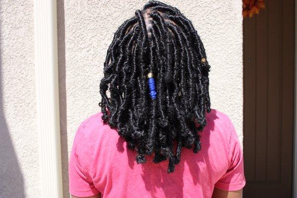 Distressed Faux Locs using water wave hair. By Marchaan @santa_clarita_braids.