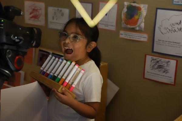 happy girl with markers at MC-CDC