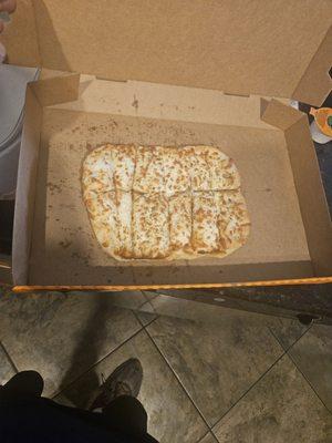 This is the cheese bread I waited 30 min for. No butter no seasoning just dry. Wrong box and not even the right shape.