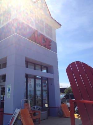 Big red chair in front. Cool store front.