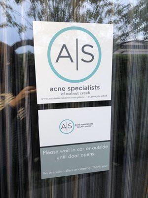 Door to acne clinic studio