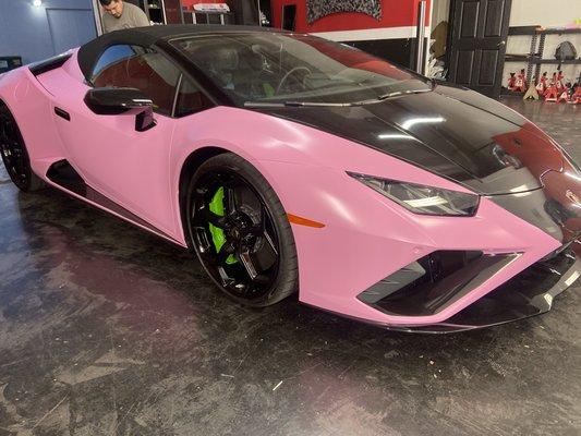 Wrapped Lamborghini in satin bubble gum with gloss black and green accents with gloss black powdercoated wheels