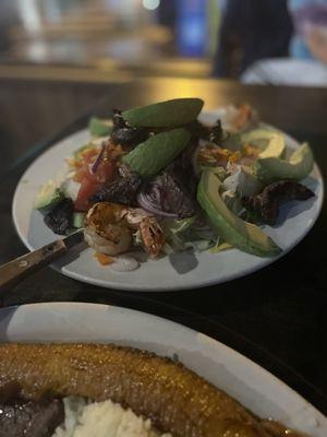 Avocado salad with steak and shrimp