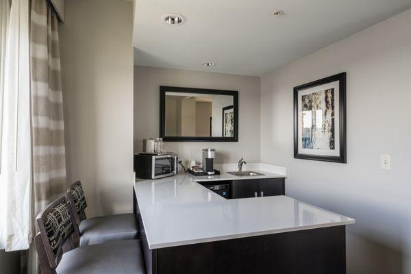 Spacious one bedroom corner suite offers a kitchenette with nice bar