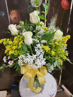 white roses with solidago and baby's breath