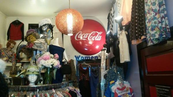 Store interior: dress rack, kids' clothes, & a coke sign I bought as a child from Ray at Ray's Ragtime.