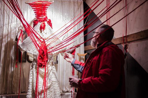 The Martyrdom of Saint Elsewhere, Dorothy Melander-Dayton (Detroit, MI) February 2017. Wedding dress, yarn, ribbons, toys, spray paint