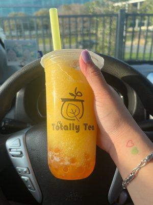 Passion fruit slush with mango boba