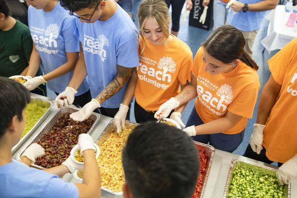 Stanbridge students prepare and serve meals to individuals and families in need at regularly Feeding the Homeless events.