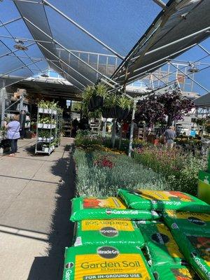 Showing the large section of gardening, materials, and flowers.