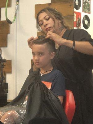 My grandson getting his haircut at big Island barber shop