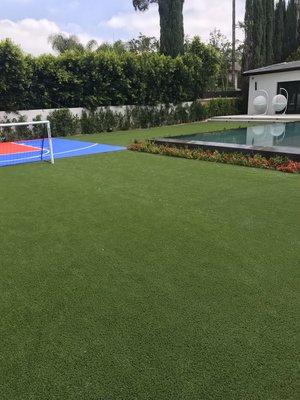 Back yard synthetic grass and basketball field