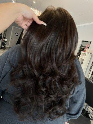 Layers on long hair finished with a blowout