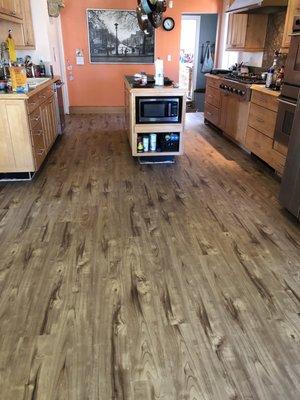 Kitchen floors down. Later toe kick and mounding was added