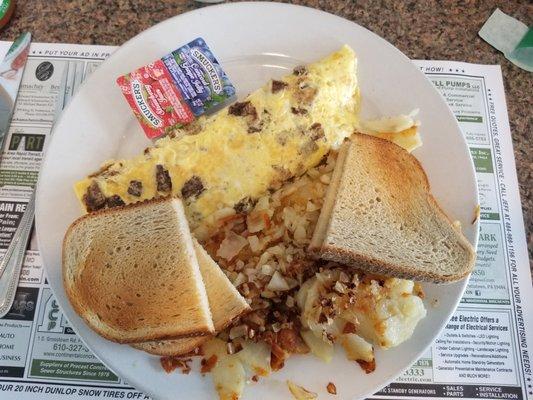 Egg omelette with scrapple and feta cheese, homefries (chopped onions) and rye toast