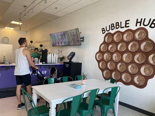 Cute little lobby with a boba game for people to play as they enjoy their drink.