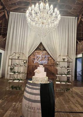 3 tier wedding cake & desserts on shelves (venue Springville Ranch)