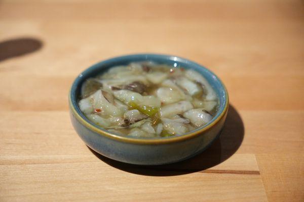 Bite-sized pieces of octopus marinated in a wasabi-infused sauce.