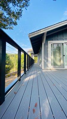 Pebble Grey Trex Deck with Black and Stainless Steel Wire Railing.