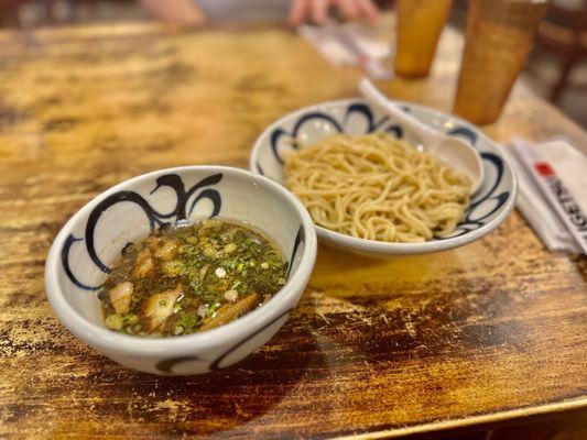 Shugetsu Tsukemen - house-made ramen noodles, served with a smoky ramen broth with grilled pork, bamboo shoots, and green onions