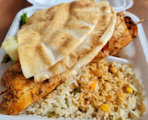 Veggie rice, pita, chicken kabob, and veggies