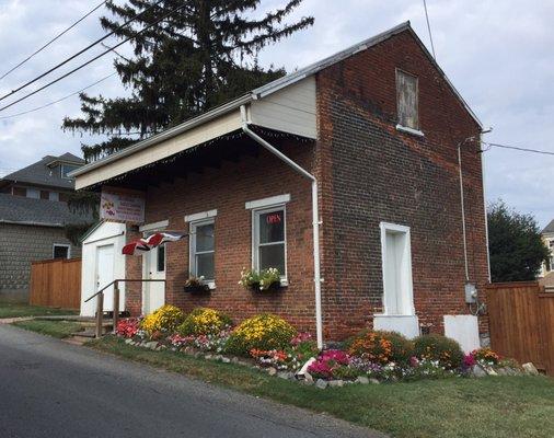 Sweet Shoppe with sweet flowers welcoming visitors.