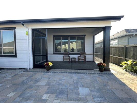 Screened-in patio with hinged door