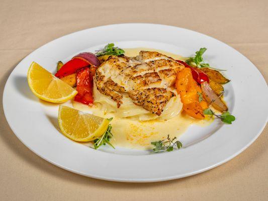 Chiliean Sea Bass steak served with creamy mash potatoes and grilled veggies.