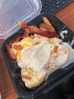 Chicken biscuit and gravy bowl eggs over easy w/ side of bacon and sausage - it was delicious!