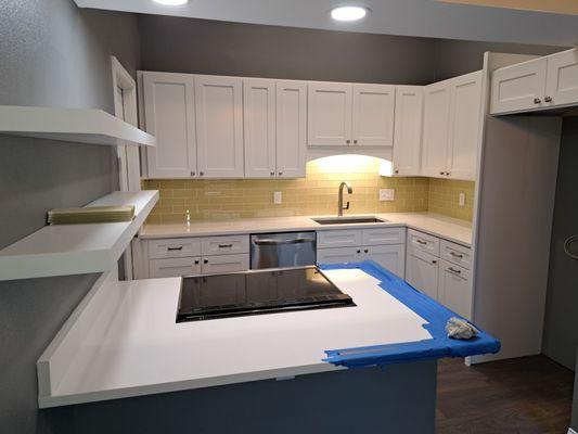 Remodeled Kitchen featuring white shaker cabinets and Cambria Quartz countertops