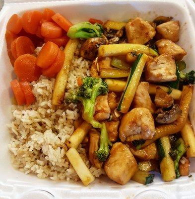 Teriyaki chicken with sweet carrots and fried rice.