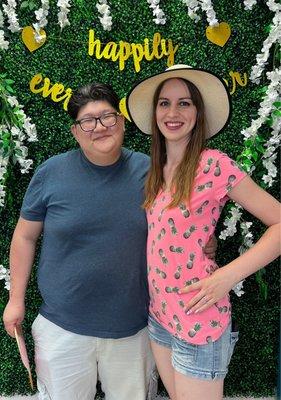 My hubby and I posing in front of  their "Happily Ever After" backdrop!