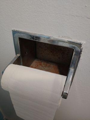 Rusty toilet paper holder