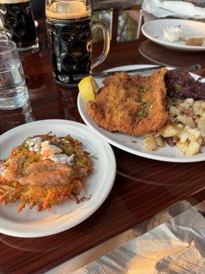 Pork schnitzel, red cabbage and potatoes along with some potato pancakes and a stout ale.