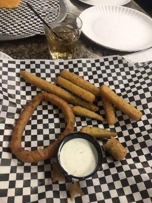 Half eaten appetizer trio: originally 3 onion rings, 2 mozzarella sticks, and a healthy helping of zucchini sticks