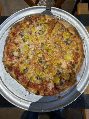 Small pizza with mushroom, onion, banana peppers