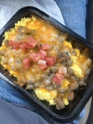 The sausage, egg, cheese breakfast scrambler with pico de gallo added from the condiment bar.