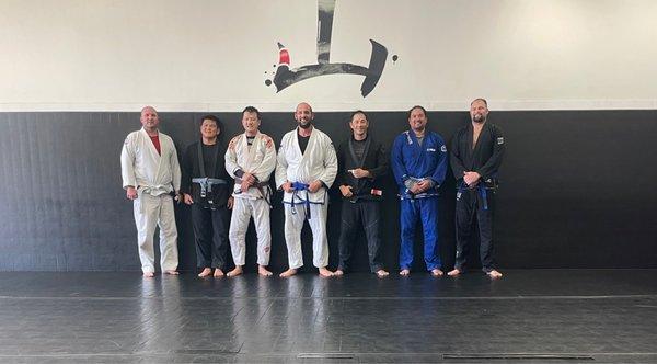 Promotion of competition class membership to blue belt.