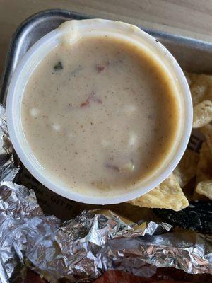 Very flavorful queso. Non traditional though somewhat spicy w a mild smoky flavor.