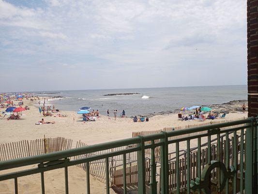 View of the beach and ocean from picnic table seating