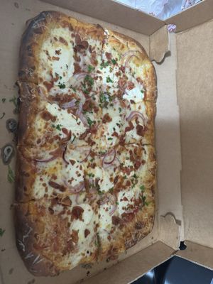 Ricotta bacon and red onion pizza