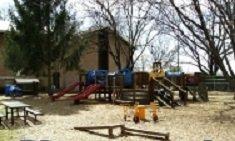 Our outdoor playground features a literacy gazebo, drums, sandbox, and a sidewalk for trikes.