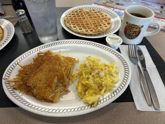 Waffle with a side of scrambled eggs, hash browns and coffee!