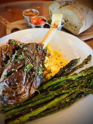 Braised lamb shank, grilled asparagus, saffron rice, rustic multigrain loaf. Lamb fell off the bone