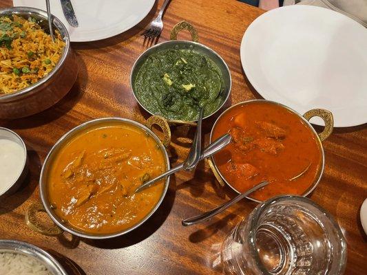 Butter Chicken (orange) good sauce, Palak Paneer (green), chicken vendaloo (hot, red)