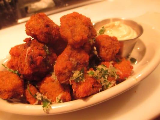 Breaded mushrooms with garlic dipping sauce.