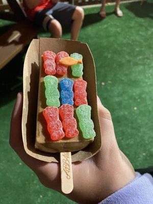 A coffee popsicle with sour patch kids