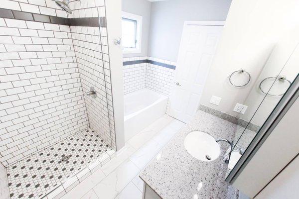 Grey and white bathroom remodel. See more images here https://cyclonecontracting.com/project/gray-white-bathroom-remodel/