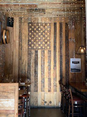 There are two US flags in the bar area.  Love patriotism