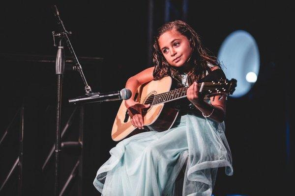 Guitar student performing at one of our recitals.